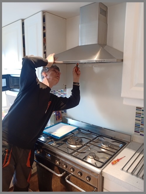 Kitchen hood installer in Cheltenham preparing commercial extraction canopy